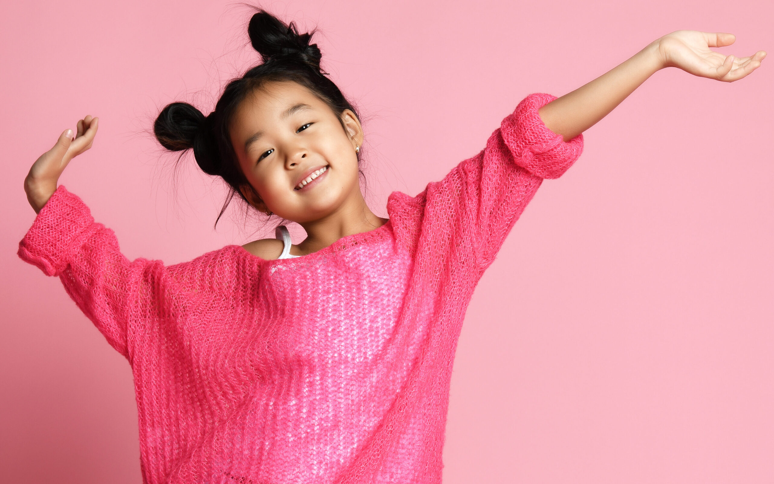 joyful Asian girl in pink